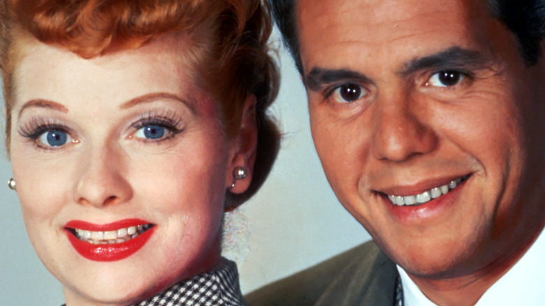 Lucille Ball and Desi Arnaz posing