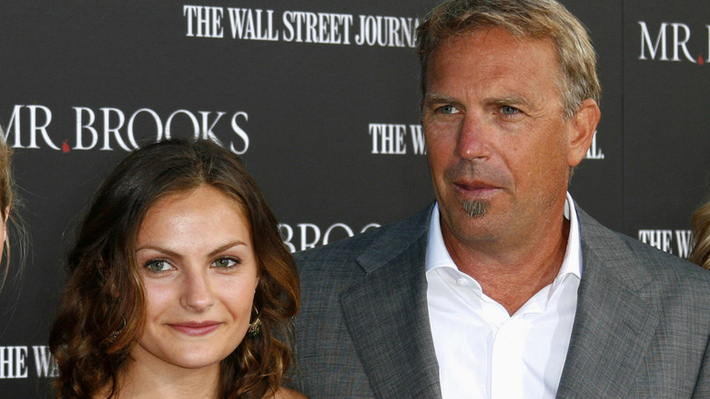 Annie Costner smiling with Kevin Costner