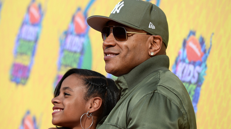 LL Cool J smiling with his daughter