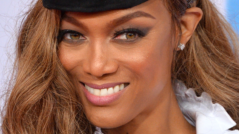 Tyra Banks smiles