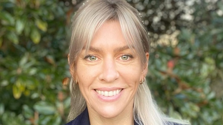 Closeup of Hannah Mae Brobst smiling in a garden