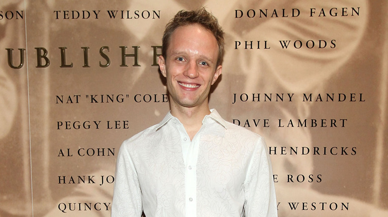 Aron Accurso in a white button-down shirt
