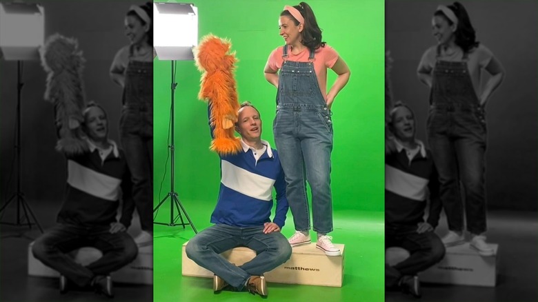 Aron Accurso holding Herbie puppet alongside Ms. Rachel
