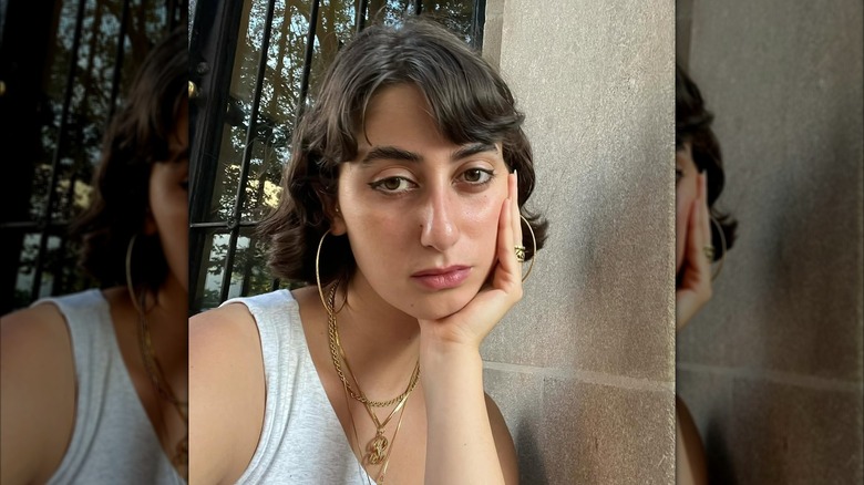 Rama Duwaji posing for photos in a white top