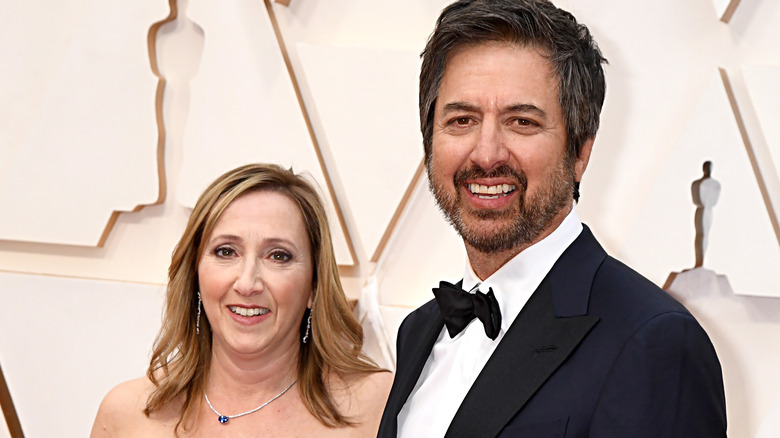 Anna Romano and Ray Romano smiling on the Oscars red carpet
