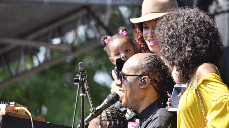 Stevie Wonder performing with family