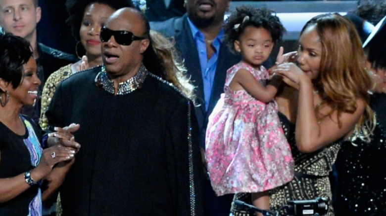 Stevie Wonder on stage with family 