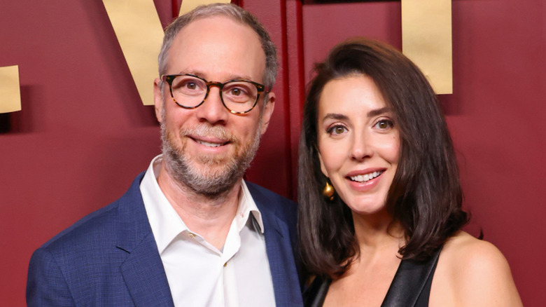 Kevin Sussman and Addie Hall smiling while posing together at an event