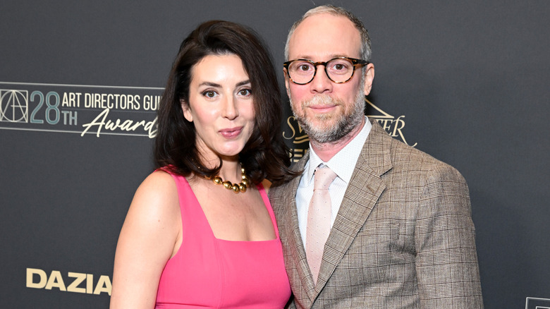 Addie Hall with Kevin Sussman smiling while posing together at an event