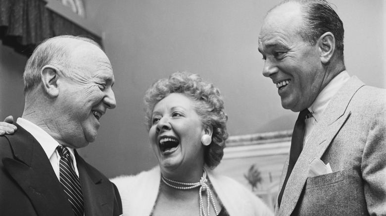 American actress Vivian Vance (1909 - 1979) with William Frawley (1887 - 1966, left), who plays her screen husband in the television show 'I Love Lucy', and her real-life husband, actor Philip Ober (1902 - 1982, right), at home, USA, circa 1955.