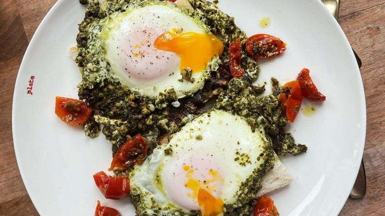 Pesto eggs with runny yolks