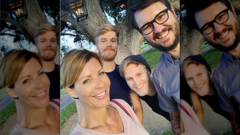Wil Wheaton and Anne Wheaton smiling with their sons in 2019