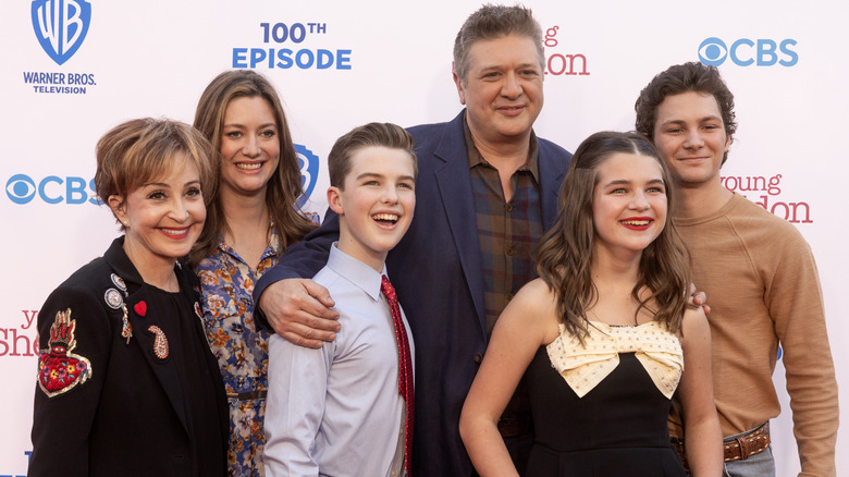 Stars of Young Sheldon posing together at the 100th episode premiere event