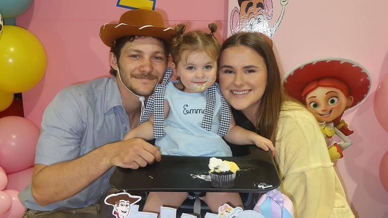 (l-r): Montana Jordan, his daughter, Emma, and wife, Jenna Weeks celebrating Emma's 2nd birthday.