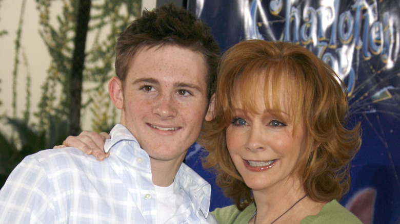 (l-r): Reba McEntire's son, Shelby Steven McEntire Blackstock, and her on the red carpet