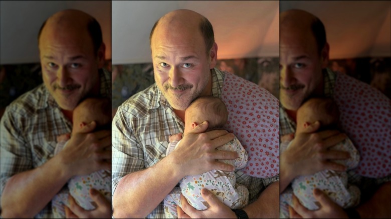 Will Sasso holding his infant daughter