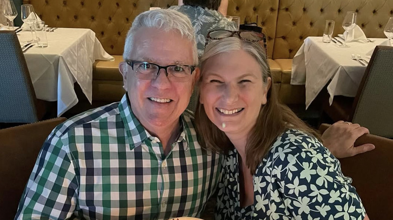 Scott Valentine smiling with Jennifer Wood in a restaurant.