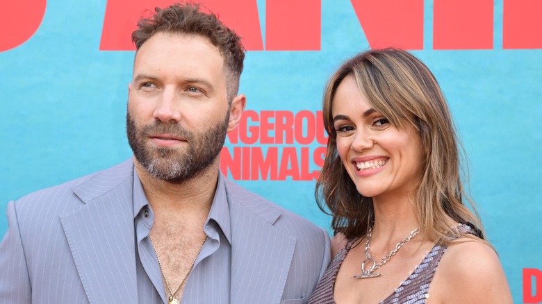 Jia Courtney & his wife Dina Shihabi attend the premiere of "Dangerous Animals"