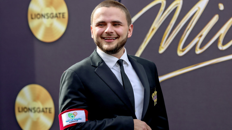 Prince Jackson laughing in a black suit