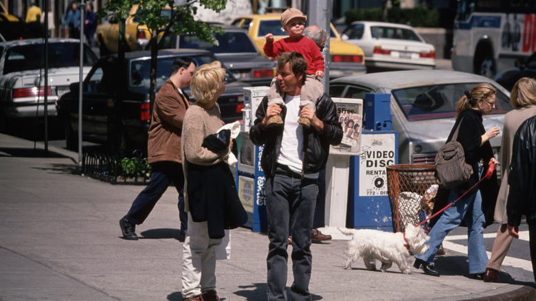 Meg Ryan and Dennis Quaid with their son on a Manhattan street.