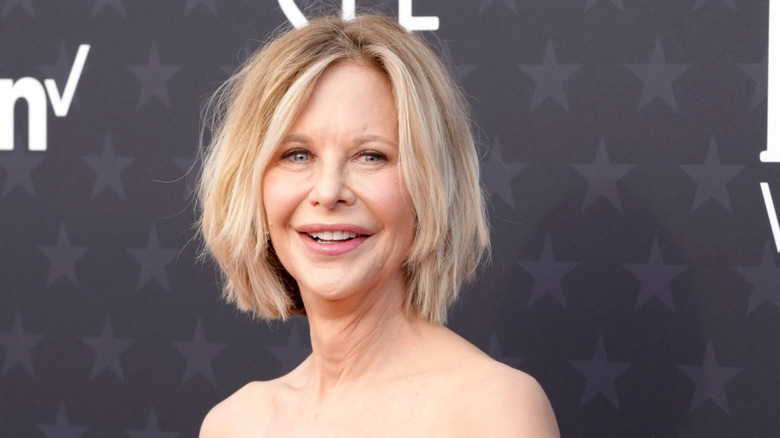 Meg Ryan smiling in a black dress at the 29th annual critics' choice awards.