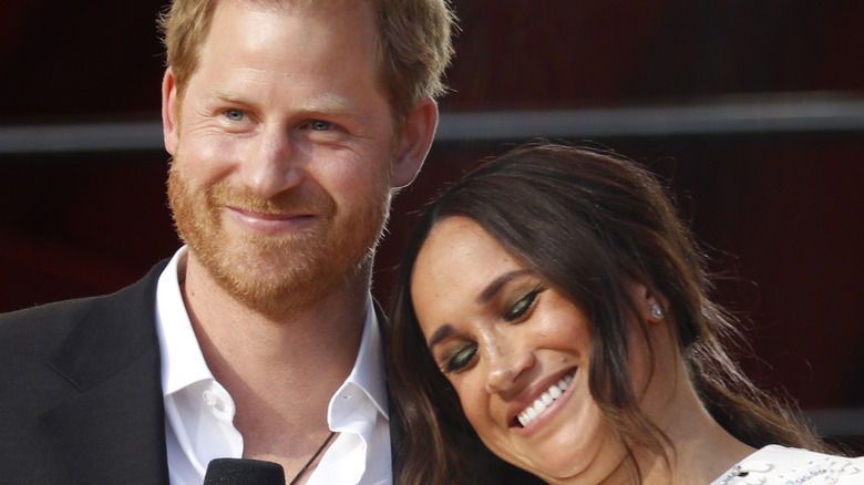 Prince Harry and Meghan Markle smiling