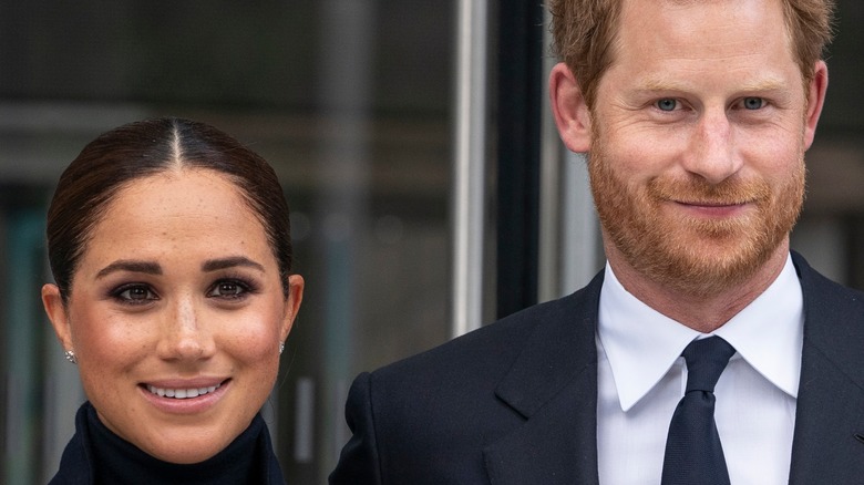 Prince Harry and Meghan Markle smiling