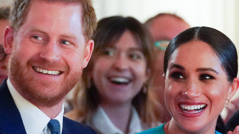 Meghan and Harry smiling