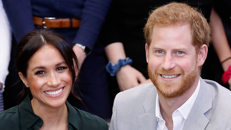 Meghan and Harry smiling