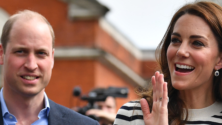Prince William and Kate Middleton greet onlookers