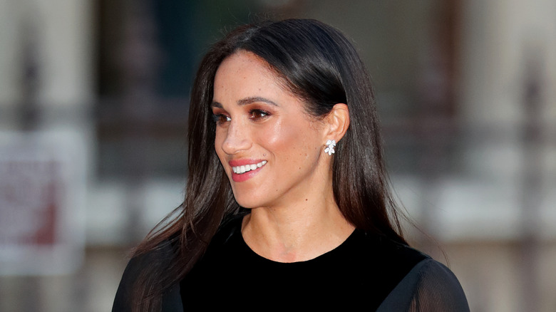 Meghan Markle smiling at an event in 2018