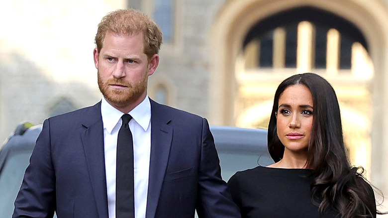 Prince Harry and Meghan Markle walking to greet mourners at Windsor Castle