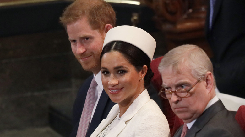 Meghan, Duchess of Sussex sits with Prince Harry, left, and Prince Andrew, right, during the Commonwealth Service at Westminster Abbey in London, Monday, March 11, 2019.