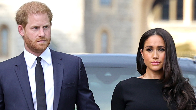 Prince Harry and Meghan Markle walking and holding hands