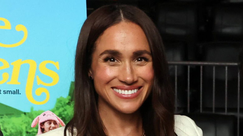 Meghan Markle smiling with hair down at Cookie Queens premiere
