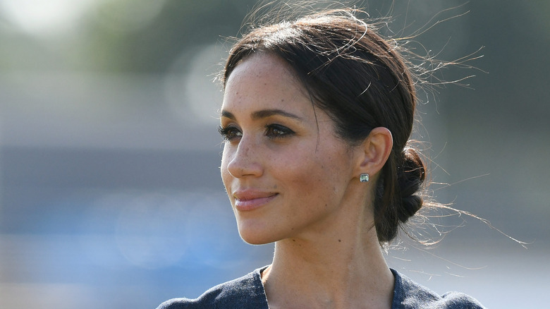Meghan Markle smiles at an event.