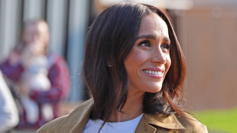 Meghan Markle smiling while visiting Australia.
