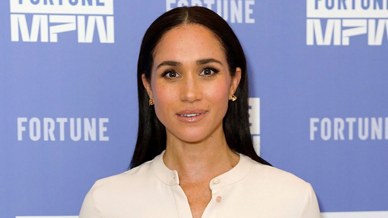 Closeup of Meghan Markle on step-and-repeat