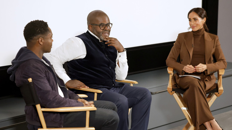 Meghan Markle on stage with David Oyelowo and Misan Harriman during interview
