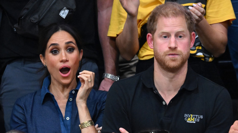 Meghan Markle and Prince Harry looking shocked