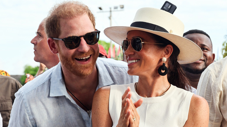 Prince Harry and Meghan Markle looking happy.