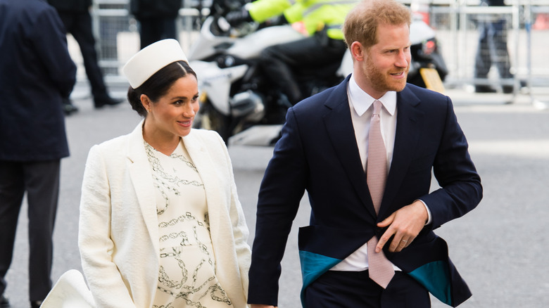 The Duke and Duchess of Sussex walking to the Commonwealth Day service in 2019