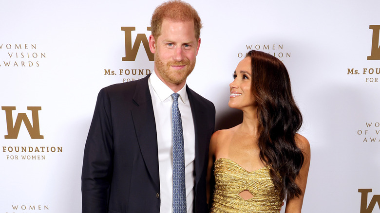 Prince Harry and Meghan Markle posing at an event