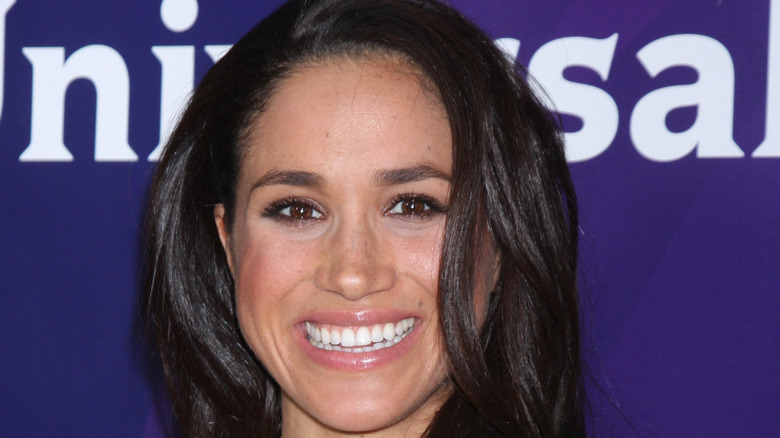 Meghan Markle smiling for a photo 
