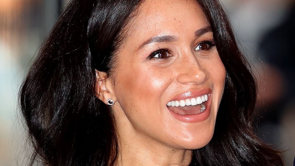 Meghan Markle looking happy as she attends a charity event in October 2019