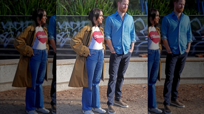 Meghan Markle in a khaki overcoat standing alongside Prince Harry