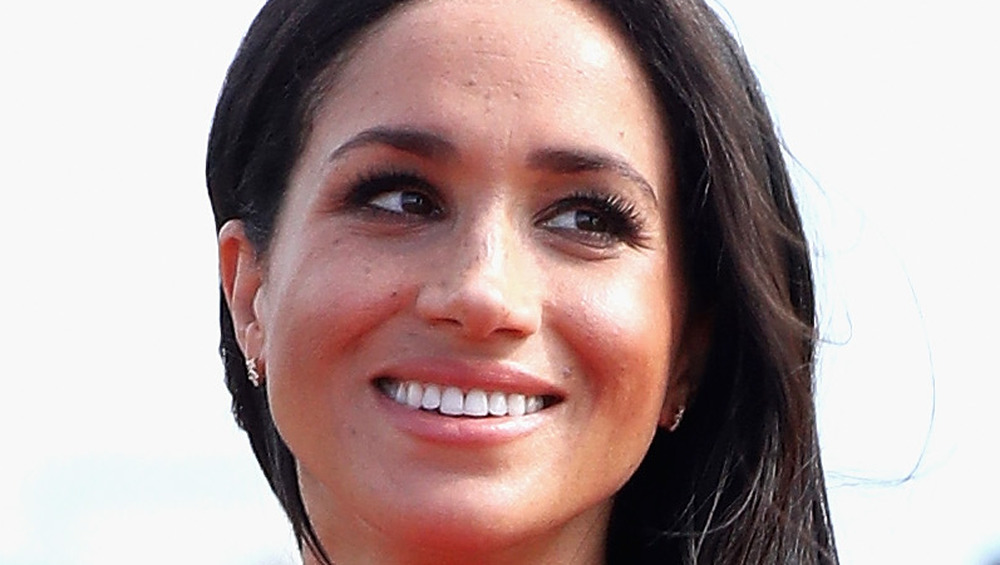 Meghan Markle smiles for photographers 