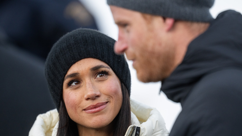 Meghan Markle smiling at Prince Harry