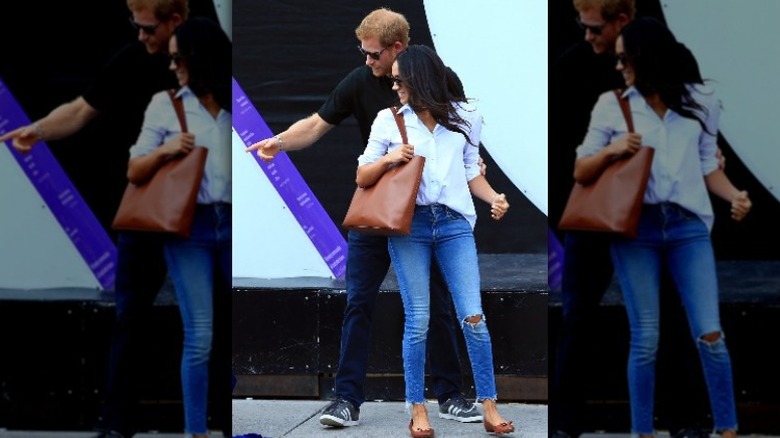 Prince Harry and Meghan Markle looking at something