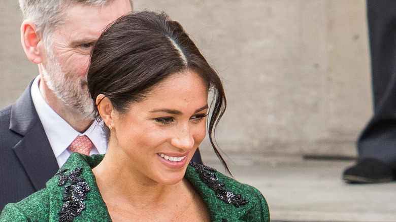 Meghan Markle looking down and to the side
